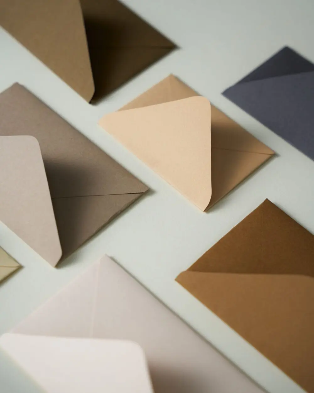 Colored envelopes on a white surface, like an FTC refund check in the mail