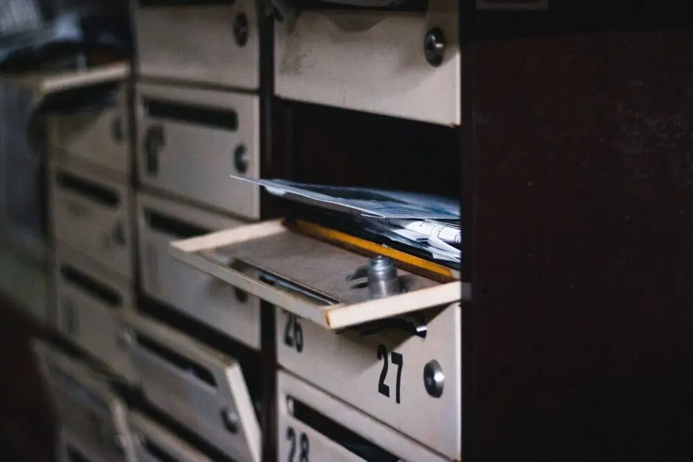 Open mailbox with letters inside in a residential building