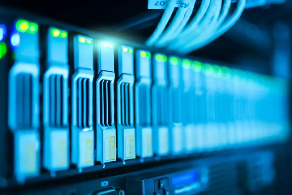 Server rack with glowing green lights, representing AI compute behind SpaceX earnings