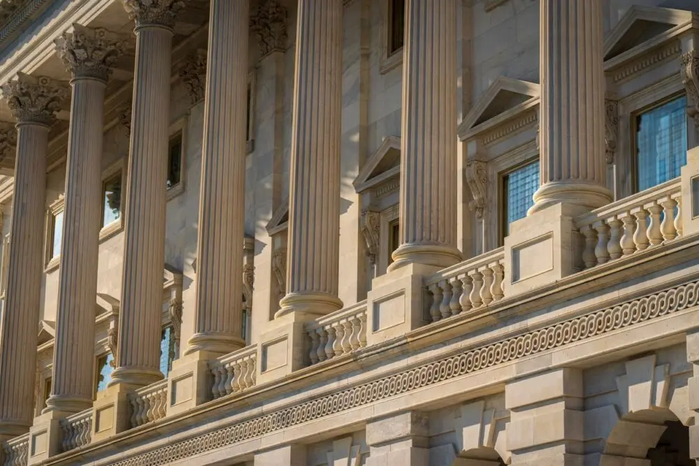 Stone columns on a government building, where the OCC stablecoin rule was issued