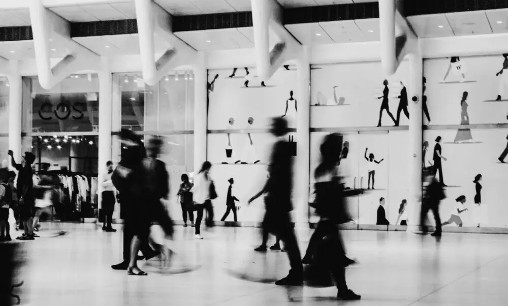 Blurred shoppers in a busy store as holiday spending nears after September retail sales
