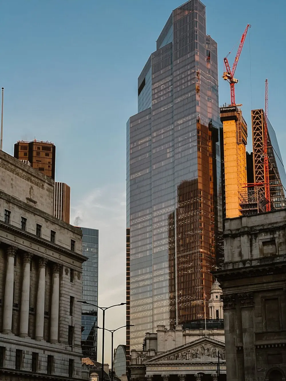 Glass skyscraper reflecting sunset light, a financial district view for Blackstone earnings
