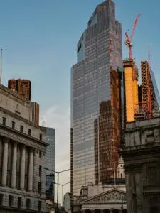 Glass skyscraper reflecting sunset light, a financial district view for Blackstone earnings