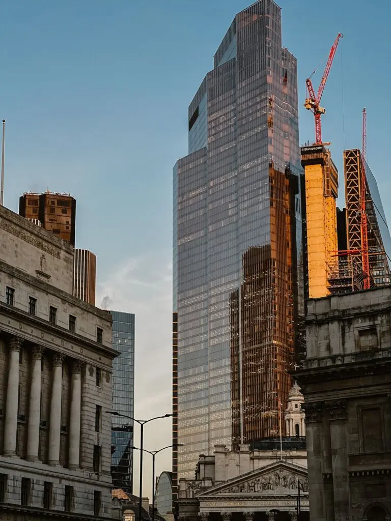 Glass skyscraper reflecting sunset light, a financial district view for Blackstone earnings