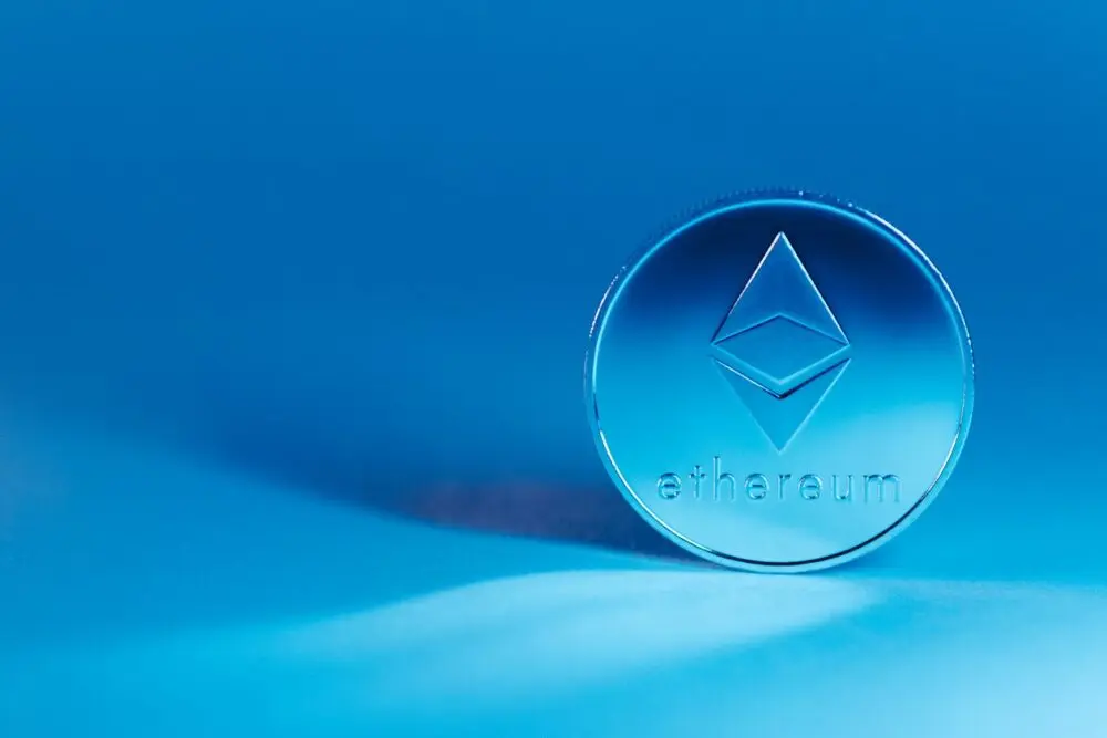 Ethereum coin standing against a blue background, representing the test crypto wallet