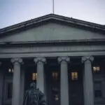 Facade of the U.S. Treasury Department building at dusk, illustrating foreign Treasury holdings