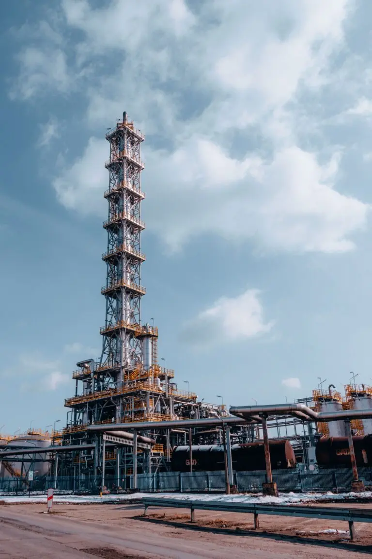An oil refinery tower against a blue sky, a symbol of the refining profits in the Exxon Chevron Q3 results