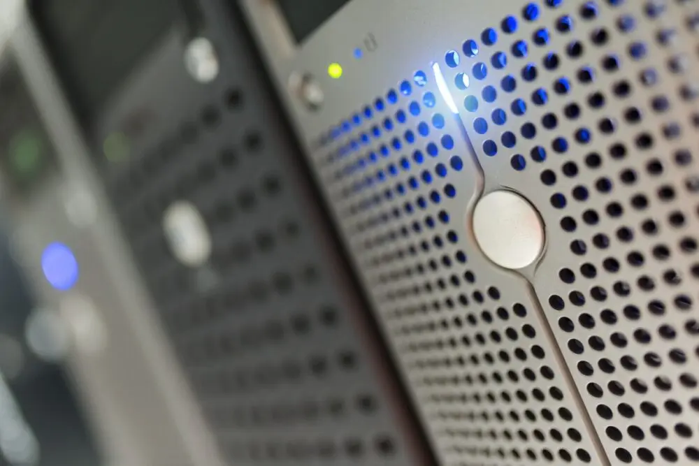 Close-up of a server's perforated front panel with indicator lights, stock image of self-hosted hardware