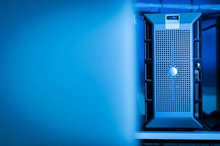 A server unit in a blue lit data center, illustrating the AI spending in focus for Big Tech earnings