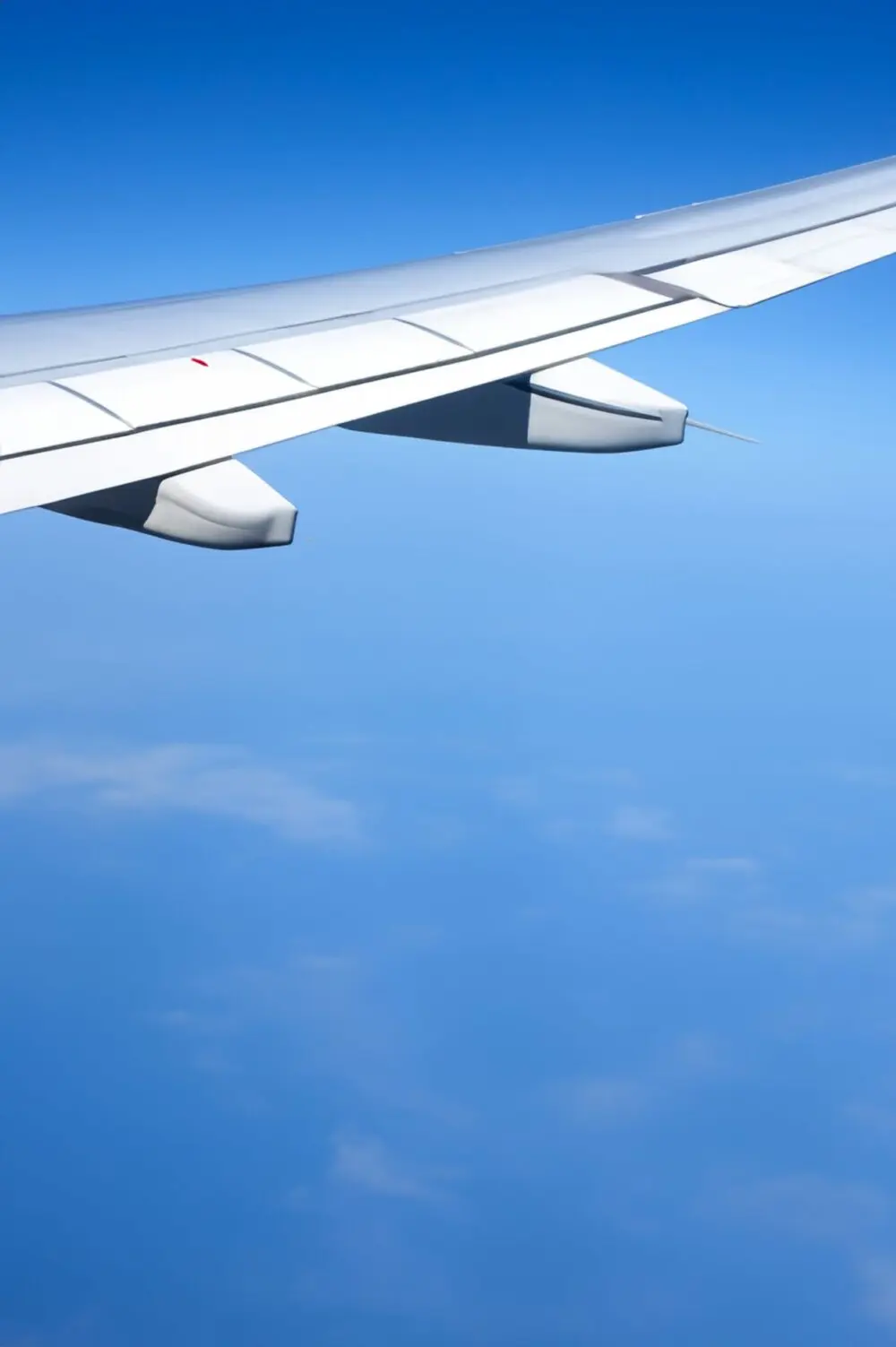 Airliner wing in clear blue sky, a picture of strong airline travel demand