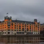 Rosenbad in Stockholm, a seat of the Swedish Government Offices, beside the water under a cloudy sky