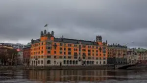 Rosenbad in Stockholm, a seat of the Swedish Government Offices, beside the water under a cloudy sky
