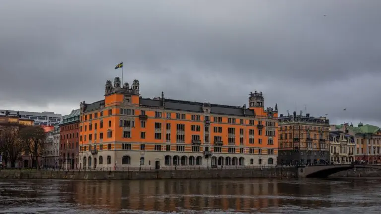 Rosenbad in Stockholm, a seat of the Swedish Government Offices, beside the water under a cloudy sky
