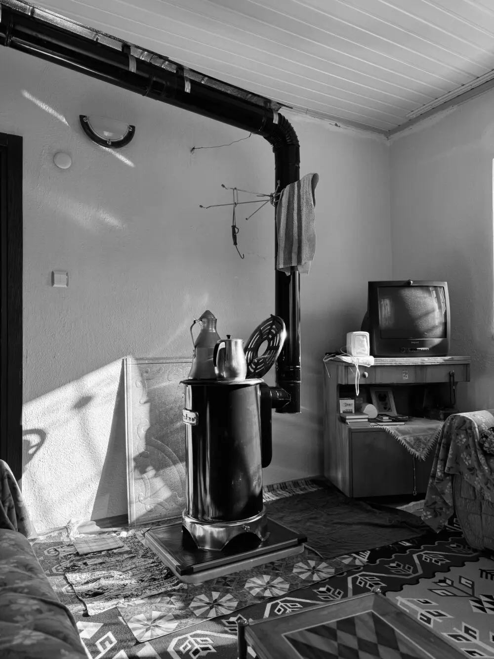 A wood stove in a cozy living room, a reminder that space heater safety applies to every heat source