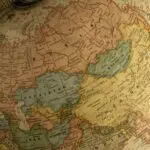 A vintage globe showing Asia and Europe, illustrating how AI blocs compete for countries like Kazakhstan