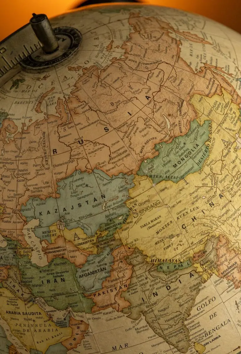 A vintage globe showing Asia and Europe, illustrating how AI blocs compete for countries like Kazakhstan