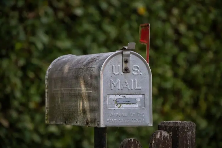 A classic U.S. mailbox with the red flag up, where an FTC refund check might arrive