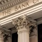 A classic bank building with columns, a reminder of how the FDIC insurance limit protects deposits