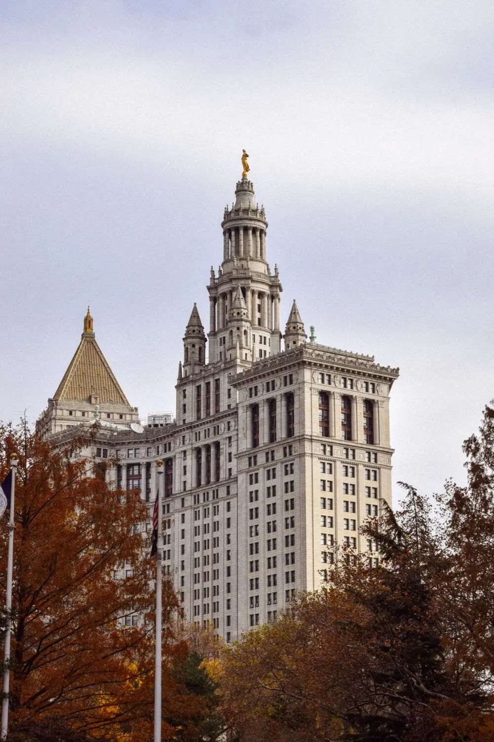 Municipal tower in Manhattan among autumn trees, in coverage of the Grok NYC Council hearing