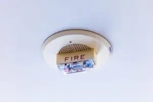 Ceiling mounted smoke and fire alarm, a reminder to change smoke alarm batteries