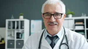 Senior doctor in an office, illustrating Medicare open enrollment 2027