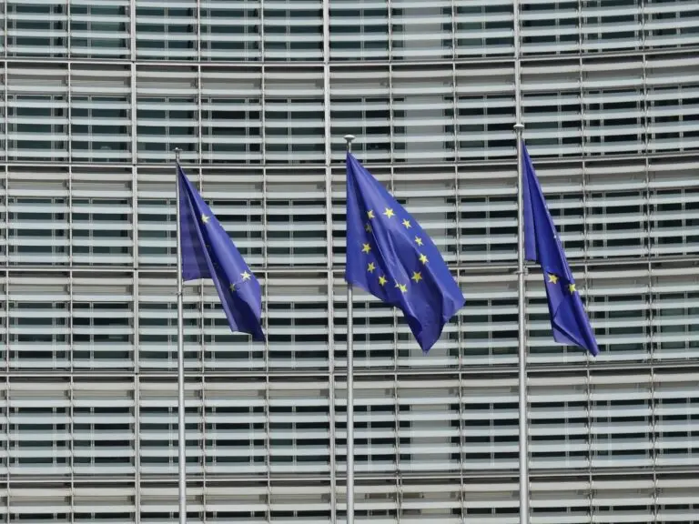 European Union flags waving, as EU AI Act enforcement begins