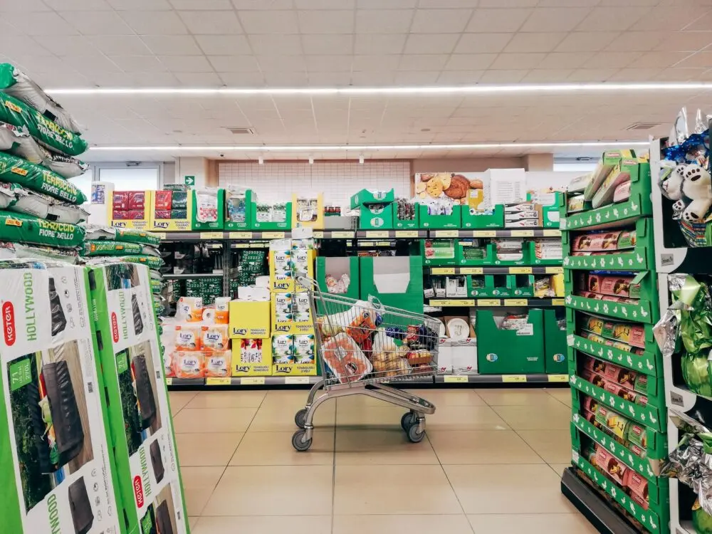 Shopping cart in a supermarket aisle, a generic image for consumer goods and Procter and Gamble earnings