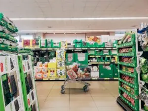 Shopping cart in a supermarket aisle, a generic image for consumer goods and Procter and Gamble earnings