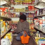 Shopper choosing goods in a store as the consumer confidence index nears its release