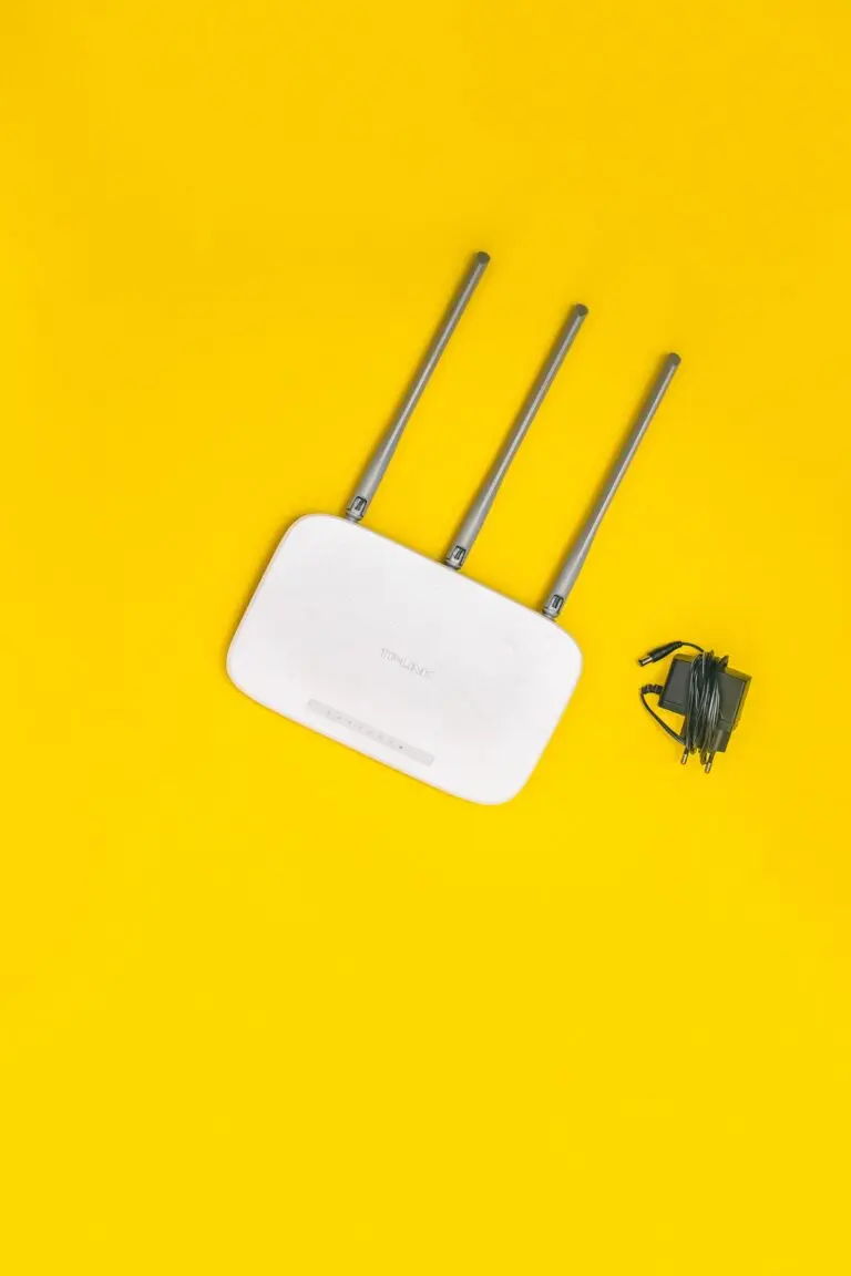 White wifi router on a yellow background, representing Comcast broadband