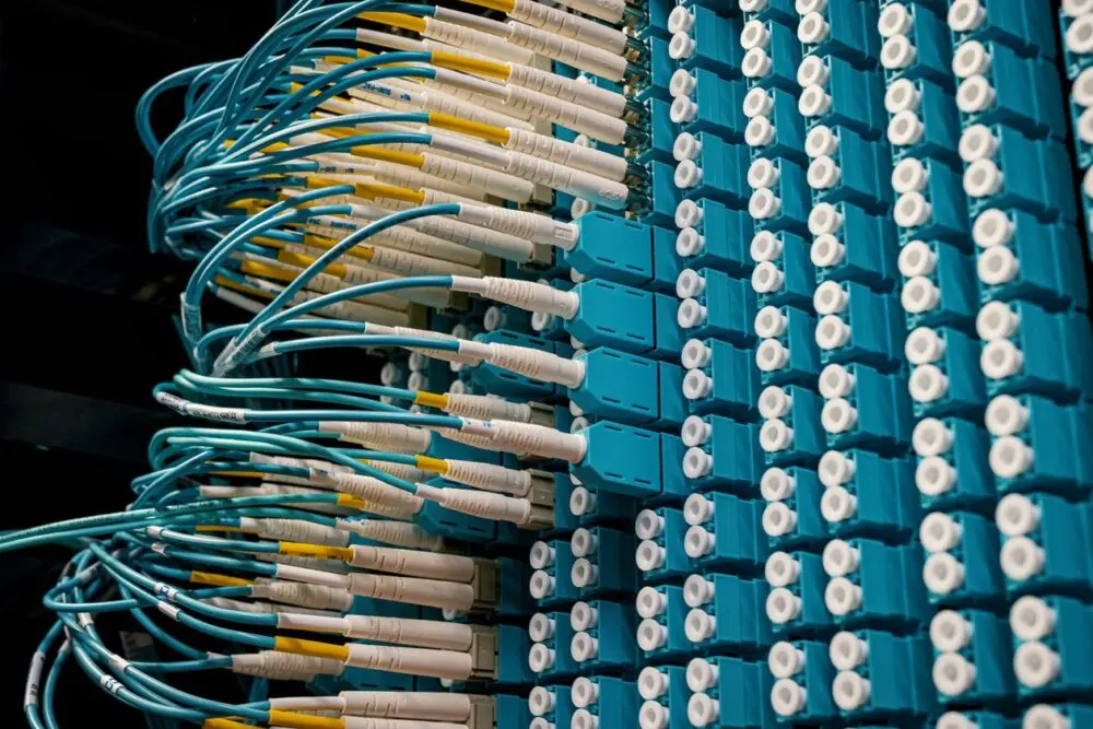 Network cables plugged into data center equipment, representing power and connectivity limits