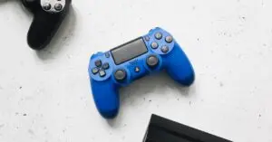 Game controllers near a PS4, ready for a factory reset PS4 guide