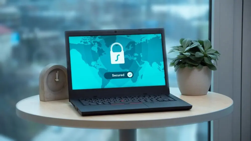 Laptop on a table showing a security lock icon, for AI agent access controls