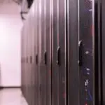 Rows of server racks in a data center, the kind of hardware inside Meta Prometheus