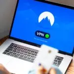 Person using a laptop with a VPN, one of the best VPN services in use