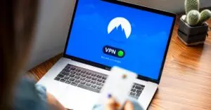 Person using a laptop with a VPN, one of the best VPN services in use
