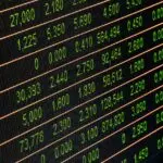 Stock market screen with green numbers, as investors weigh the Meta stock split