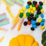 Halloween candy and mini pumpkins illustrating record Halloween spending