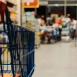 Shopping cart in a supermarket aisle, illustrating a product recall roundup