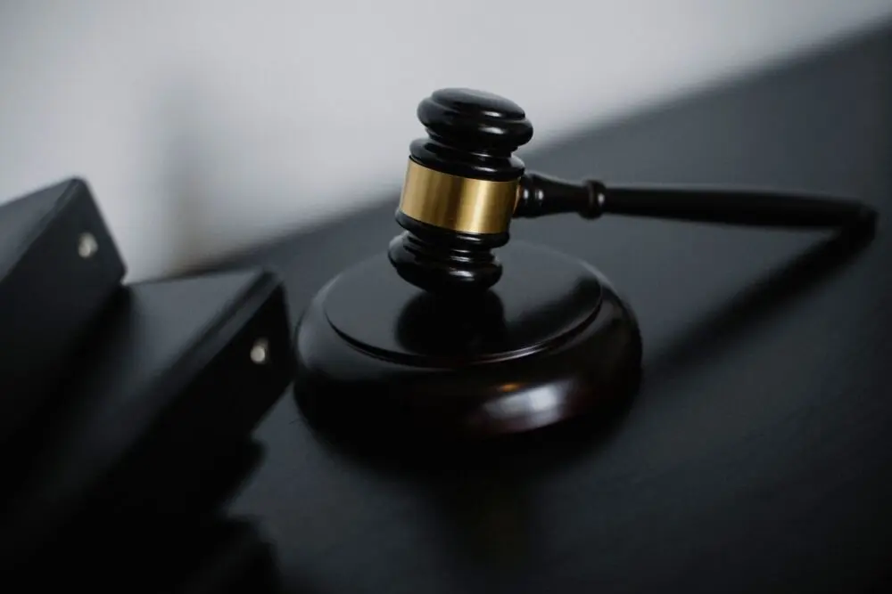 Wooden gavel on a judge's desk, representing the Character.AI bankruptcy filing in Delaware