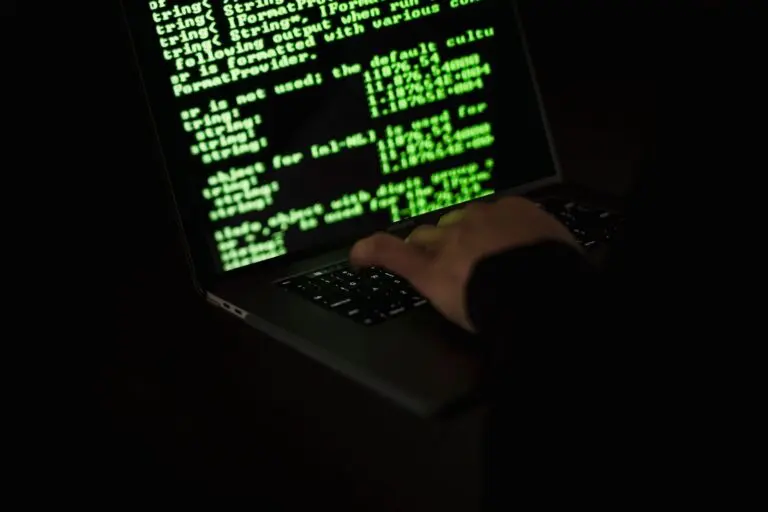 Green lines of code on a dark screen, illustrating Microsoft AI agent controls and security monitoring