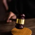 A judge's gavel on a wooden block, illustrating the case as Texas sues OpenAI