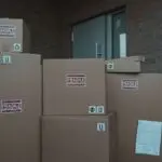 Cardboard packages marked fragile, stacked and ready to ship before the holiday shipping deadlines
