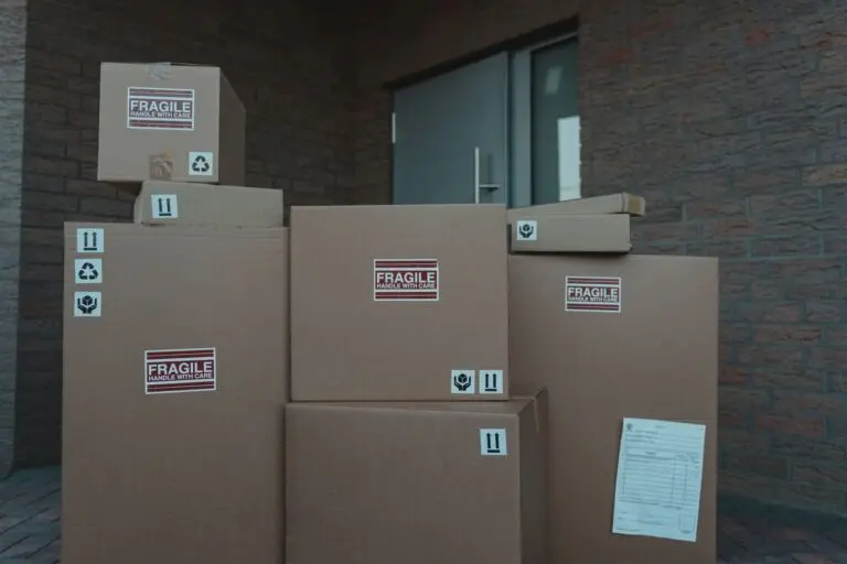 Cardboard packages marked fragile, stacked and ready to ship before the holiday shipping deadlines