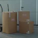 Cardboard boxes on a dolly, illustrating holiday return policies