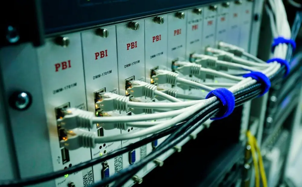 Ethernet cables connected to a network switch, similar to the Meta Prometheus back-end network