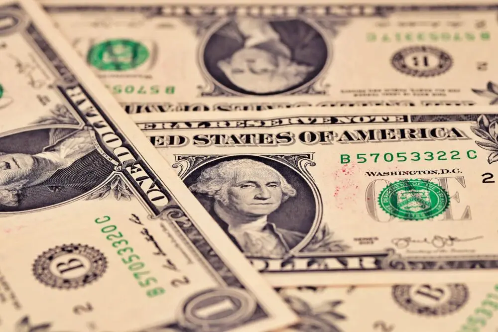 Close up of US one dollar bills, the reserves behind the OCC stablecoin rule