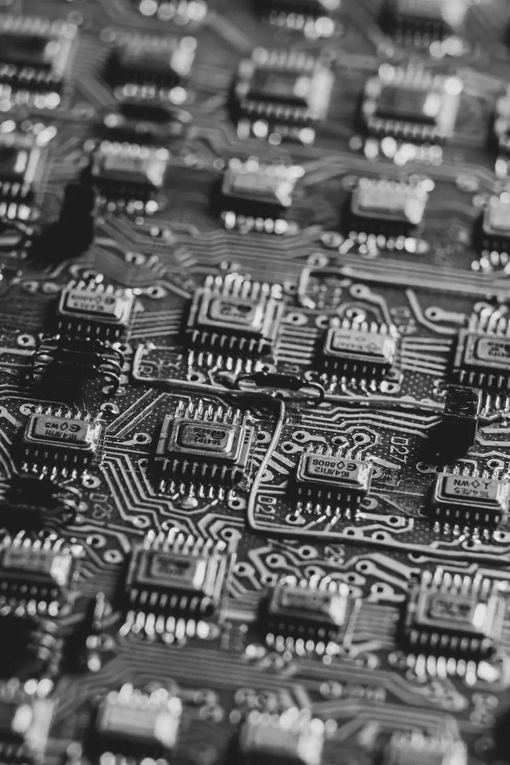 Black and white close-up of microchips on a circuit board