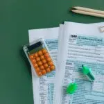 Tax forms with a calculator and pencils, a look at the 2027 tax brackets