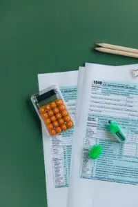 Tax forms with a calculator and pencils, a look at the 2027 tax brackets
